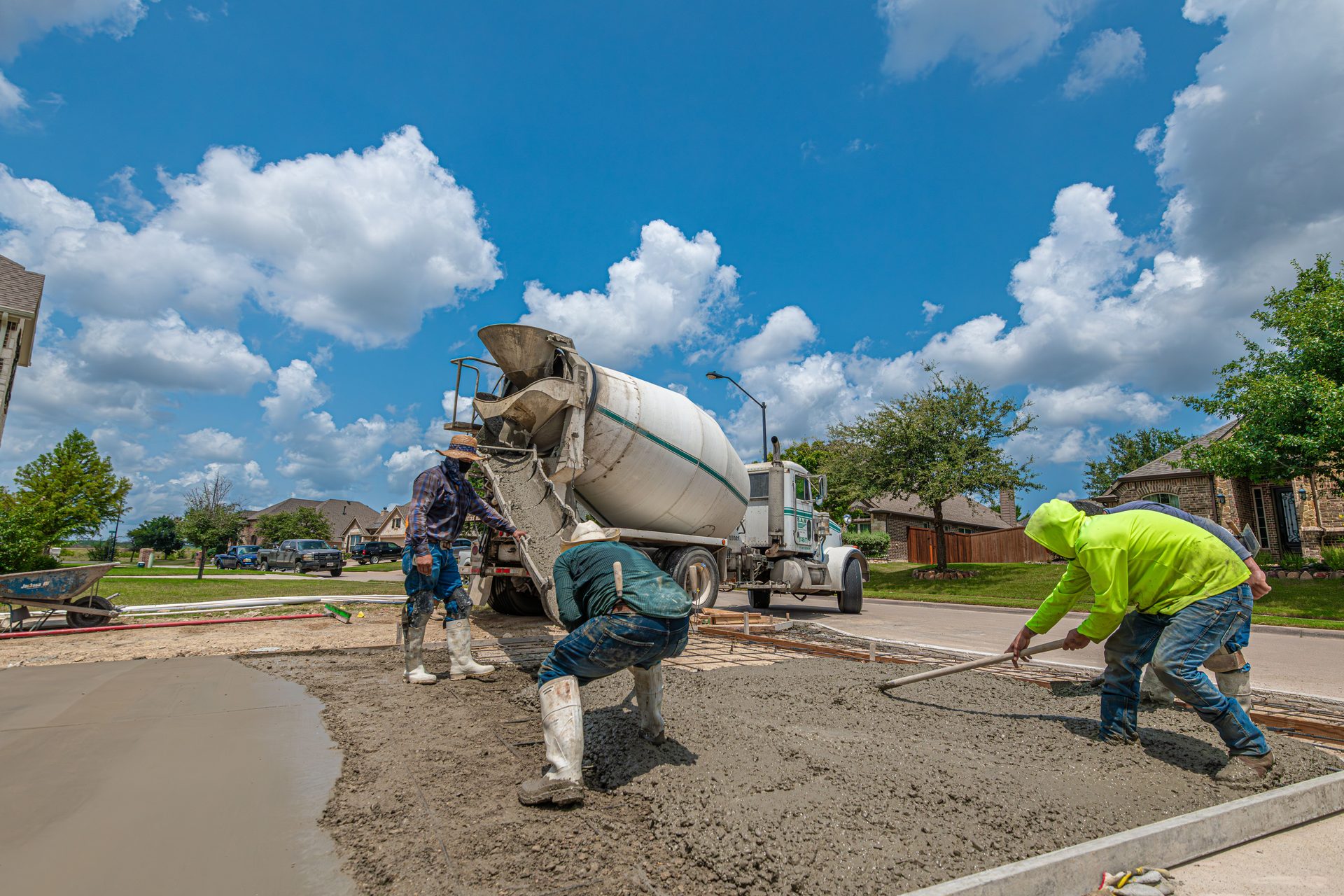 Concrete crew pouring and finishing a new residential driveway in Spartanburg, SC