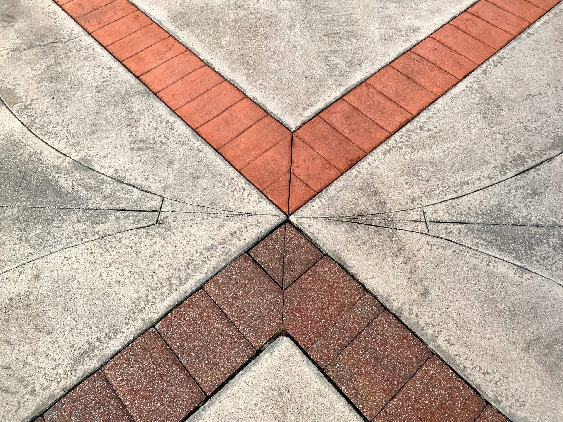 Decorative concrete with brick-inlay accent detailing at the control joints