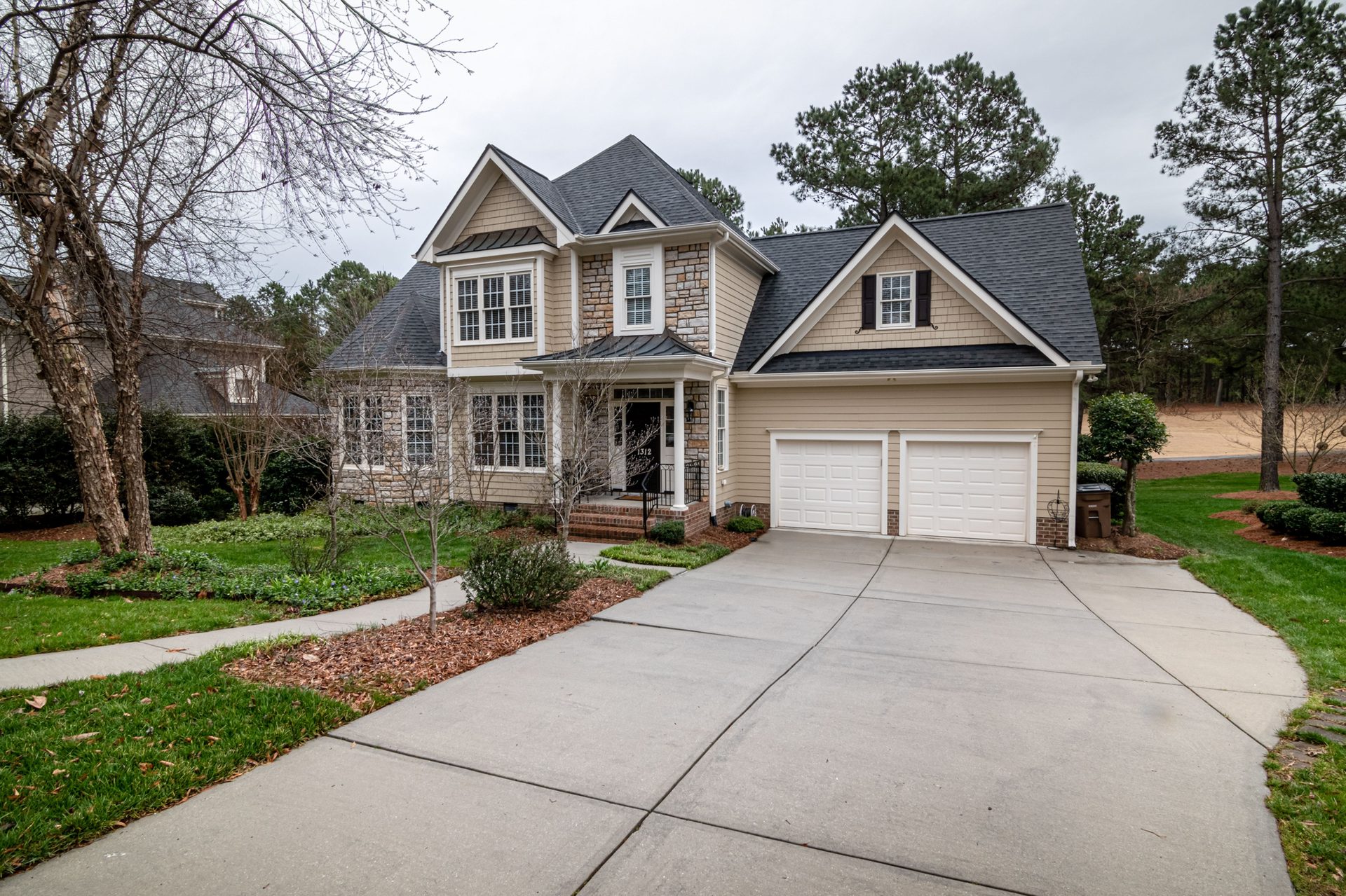 Finished concrete driveway at a two-story home in the Spartanburg, SC area